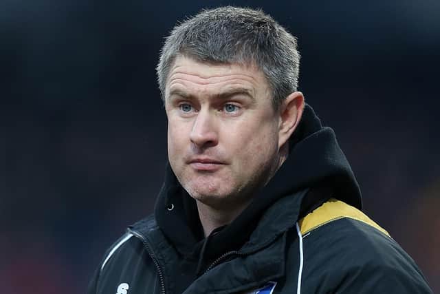 Cheltenham Town director of football Micky Moore could be on the move.