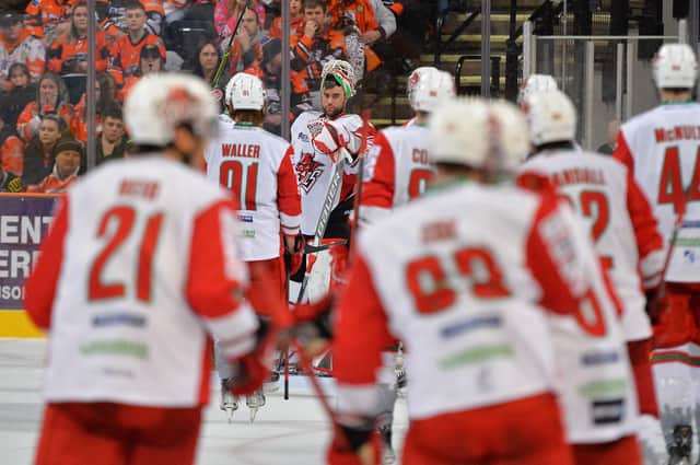 Cardiff Devils players make their way towards stellar goalie Mac Carruth Pic by Dean Woolley