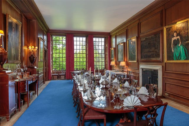 The dining room has a modest late 17th century style. The walls are panelled and the three large south facing windows look out over the steep banks of the river below.