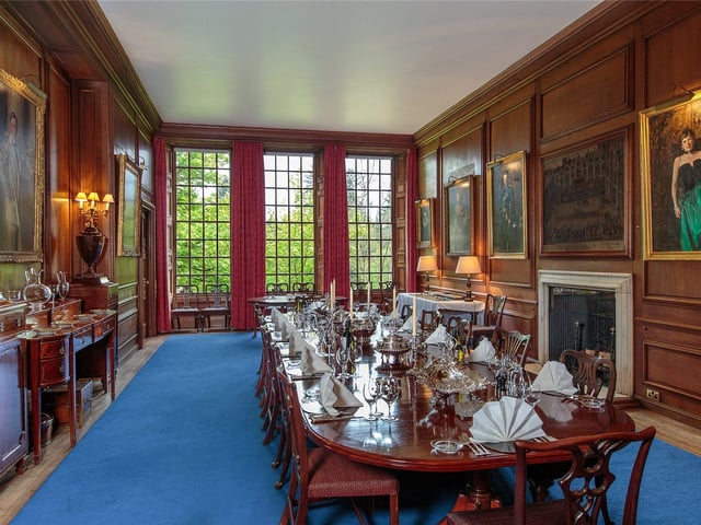 The dining room has a modest late 17th century style. The walls are panelled and the three large south facing windows look out over the steep banks of the river below.