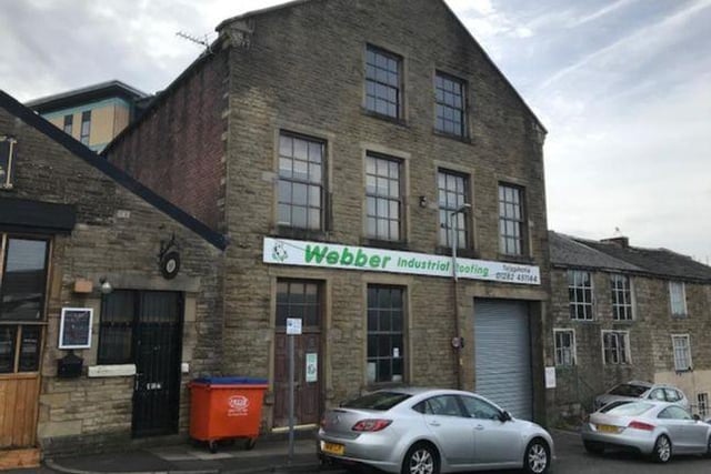 Workshop building with offices and stores above - £200,000.