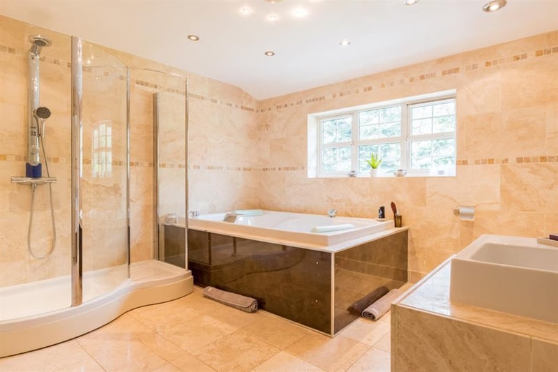 The contemporary family bathroom boasts a stylish four-piece suite, which includes a large walk-in shower, bidet, hand wash basin and a double size jacuzzi bathtub.