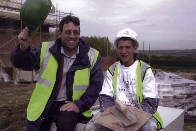 Aston Comprehensive School pupil, Ben Jones had an insight into the craft of plastering at Shepherd Homes' The Brooklands development at Staveley, Chesterfield in 2003. Pictured raising his hat to Ben's enthusiasm is Terry Clough, of Rotherham-based plastering sub-contractor Lloyd Clough.