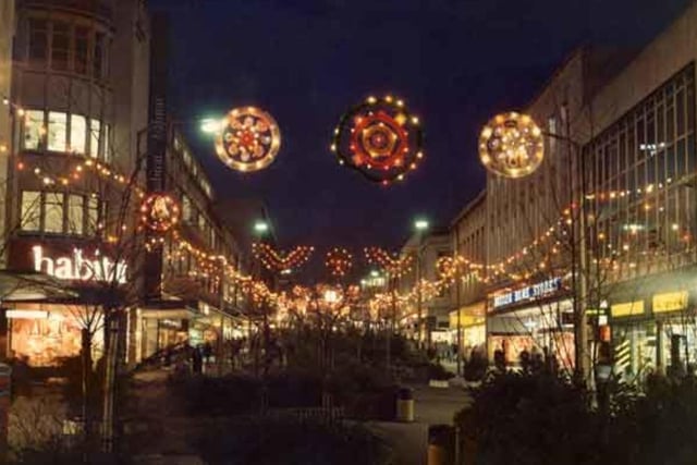 British Home Stores (right) on The Moor, in Sheffield city centre, in December 1982, with another fallen high steet giant, furniture retailer Habitat, on the left