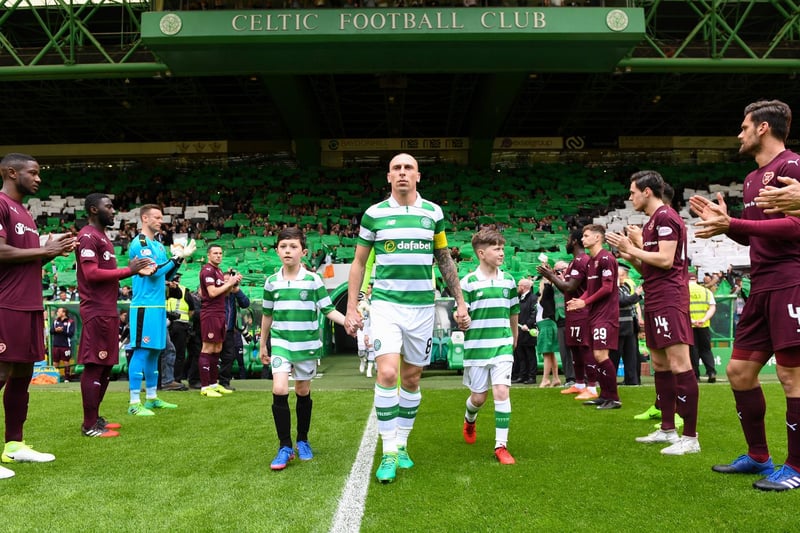 Brown leads out the league champions, who were given a guard of honour by Hearts at Celtic Park in 2017.