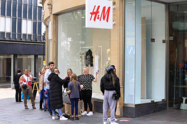 Shoppers queuing outside H&M in Sheffield city centre this morning.
