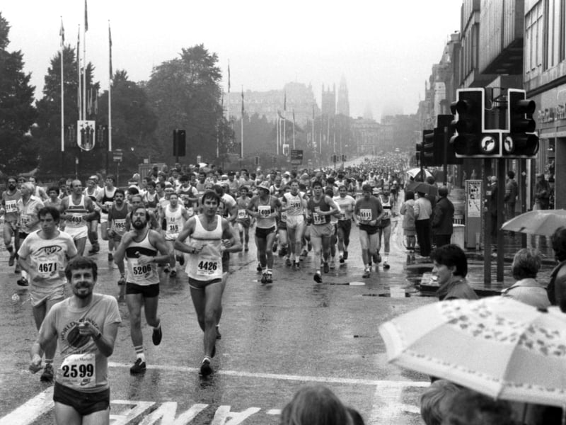 Competitior running along Princes Street in the rain during the Edinburgh Marathon in September 1984.