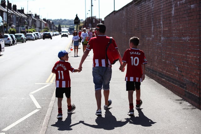 United fans arrive at the Lane for the Premier League clash with Leicester City in August 2019.