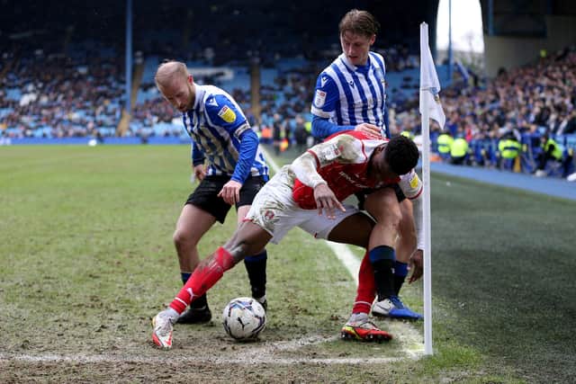 Barry Bannan and George Byers battle for the ball during Sheffield Wednesday's defeat to Rotherham United.