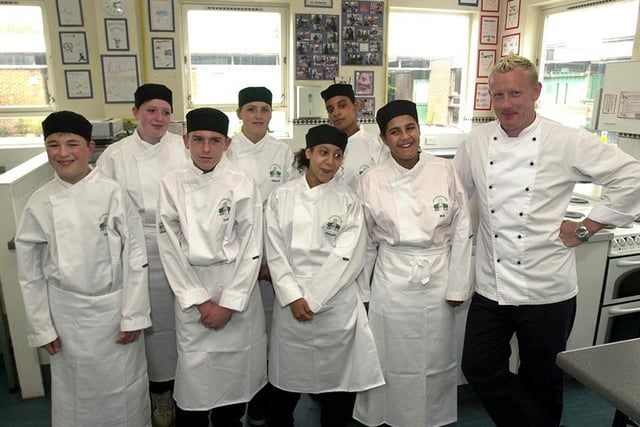 High Storrs pupils studying food and catering are seen in their new uniforms sponsored by Slammers restaurant.  Seen is Cary Brown from Slammers with pupils, left to right, Dale Lloyd, Emma Brown, David Dickinson, Hannah Gregory, Danielle Madden, Natalie Simpson, and Jade Bletcher, July 3, 2003