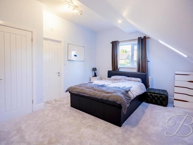 It's hard to know which bedroom to look at first, but let's start with the master. It has fitted wardrobes, a carpeted floor, Velux windows to the side and a porthole window at the front.