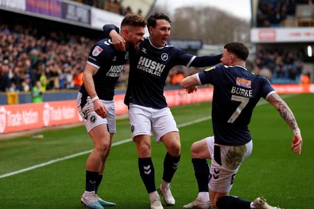Tom Bradshaw of Millwall celebrates with Danny McNamara and former Sheffield United player Oliver Burke: Andrew Redington/Getty Images
