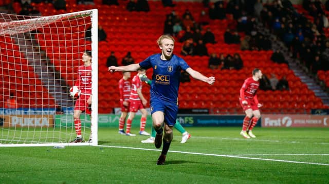 Mansfield Town midfielder George Lapslie celebrates his second goal against Doncaster Rovers during the Emirates FA Cup second round at the Keepmoat Stadium
Photo credit should read : Chris Holloway / The Bigger Picture.media