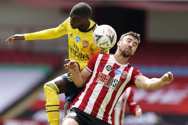 Enda Stevens of Sheffield Utd  (R) vies with Nicolas Pepe of Arsenal during the FA Cup match at Bramall Lane, Sheffield.  Andrew Yates/Sportimage