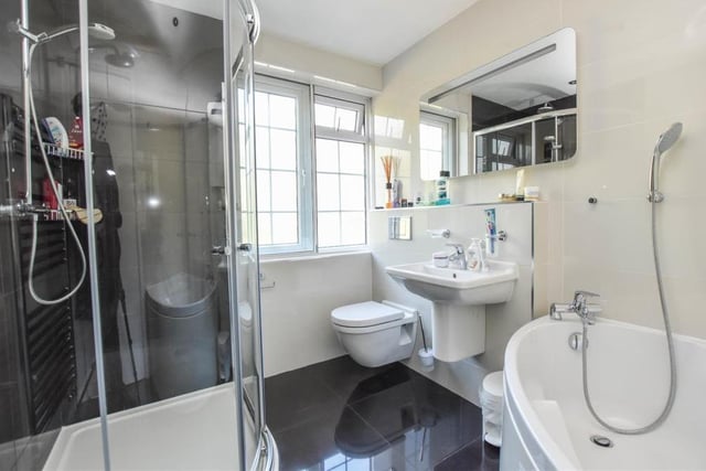The family bathroom is clean and classy. As well as a bath, there is a walk-in shower cubicle, wash hand basin and WC.
