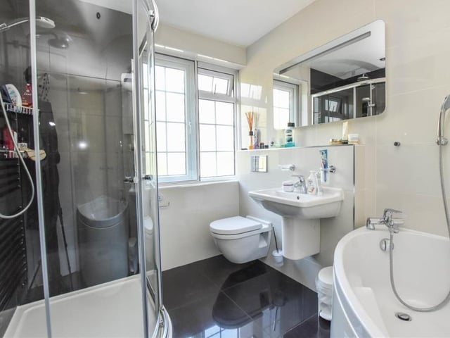 The family bathroom is clean and classy. As well as a bath, there is a walk-in shower cubicle, wash hand basin and WC.