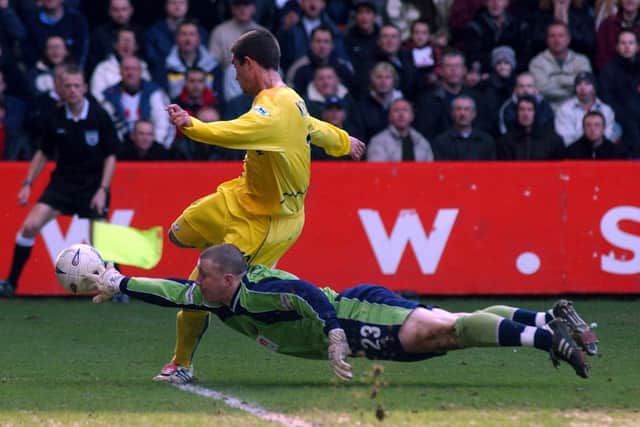 Sheffield United v Leeds United. F.A. Cup - Paddy Kenny gets his fingertips to the ball to deny Harry Kewell from close range.