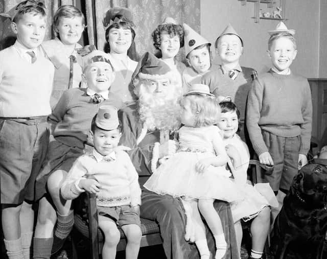 Chief Constable W Merrilees acts as Santa Claus at an Edinburgh Children's Home Christmas party in 1962.