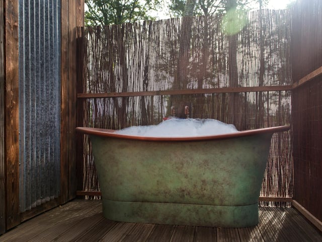 Copper baths have been installed on the porch of each treehouse to allow guests to enjoy a warm dip outside. "Even though the weather is a bit cold at the moment, you can sit and enjoy a warm bath outside while listening to the birds and admiring the beautiful forest around you," Louisa said, "and we chose copper because we love the aesthetic and they also last a long time."