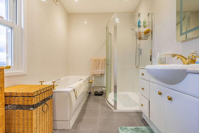 There is a fully-tiled family bathroom, with separate shower cubicle and bath and a further shower room.