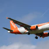 LONDON, ENGLAND - MARCH 27: An easyJet aeroplane comes in for landing at Gatwick Airport on March 27, 2022 in London, England. Gatwick's South terminal closed in June 2020 to reduce costs during the Coronvirus pandemic when traveller numbers reduced significantly. It has undergone months of refurbishment and re-opens today to meet the expected increased demand for air travel over Easter and the coming summer now that restrictions have been lifted. (Photo by Hollie Adams/Getty Images)