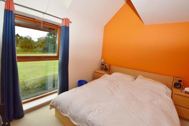 The third bedroom is smart and comfortable. It looks out on to the front of the Windmill Hill property and features an upright radiator, vaulted ceiling and built-in wardrobe.