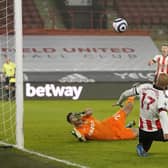 David McGoldrick of Sheffield United scoring his side's opening goal during the Premier League match against Aston Villa at Bramall Lane  Andrew Yates/Sportimage