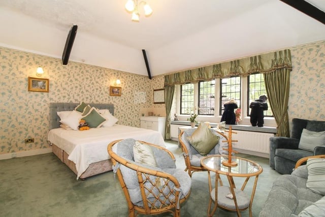 This is one of the bedrooms in the property. They are all large, bright and extremely spacious, with stunning views over the property's gardens.