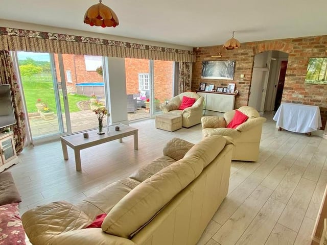 Another view of the sitting room shows how bright and airy it is. Imagine relaxing and enjoying the views.