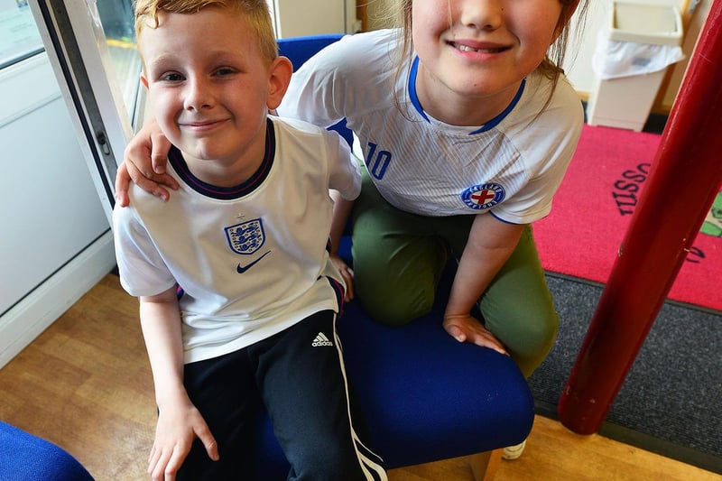 Rossmere Primary School pupils Bentley Spence and Poppy-Anne Osbourne sport their England shirts. Picture by FRANK REID