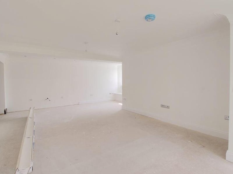 The sizeable kitchen area. There is no kitchen fitted, and the property will be sold without one, enabling the buyers to select their own units and appliances.