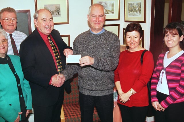 Bryan Cloves presented a cheque for £600 to St Luke's after completing a Coast to Coast walk in 1999. Seen LtoR are,  Muriel Cloves, Dr Terry Crowther,  Malcolm Rapson Chief Administrator of St Lukes who received the cheque,  Bryan Cloves the walker, Sue Cloves, and Rebecca Cloves.