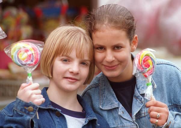 Debbie Stevens,13 of Norfolk Park, and Sarah Cryer, 11, from Owlthorpe, with sweets from the Sweet Factory in 1997