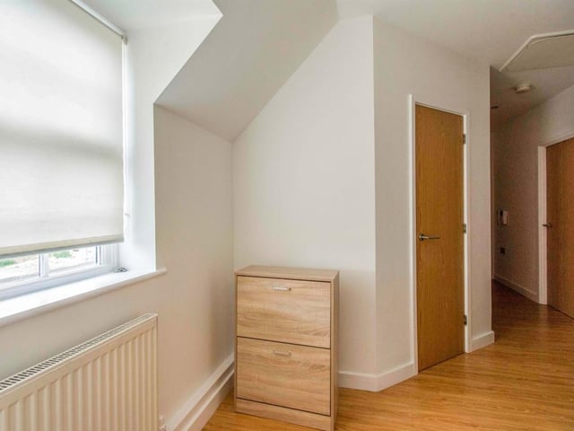 Entrance hall - With a side facing door to the communal entrance hallway, a rear facing double glazed window and a central heating radiator.