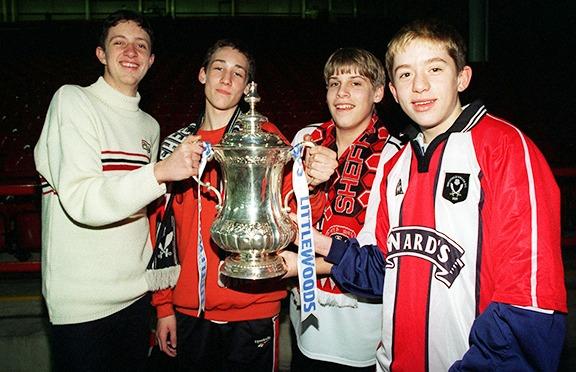 Blades fans Matthew Lambert, Joss Wilson, Keir Foster and Ben Harrison, all of Birley School, pictured with the FA Cup at the Sheffield United v Reading match on February 13, 1998