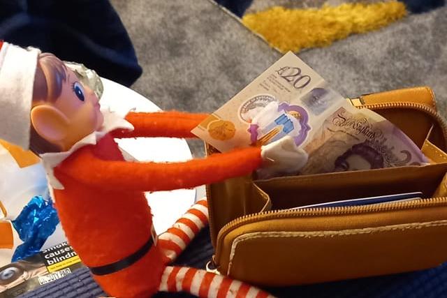 This cheeky elf is stealing from a purse. From Tracey Burns.