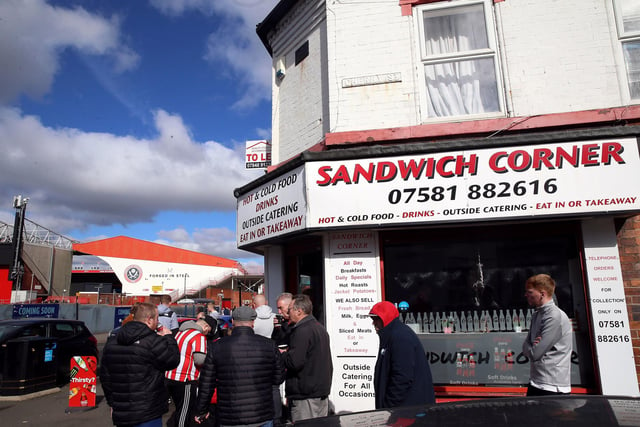 Fans have food and drinks from Sandwich Corner near the ground ahead of the Emirates FA Cup quarter final match at Bramall Lane, Sheffield.  Nigel French/PA Wire.