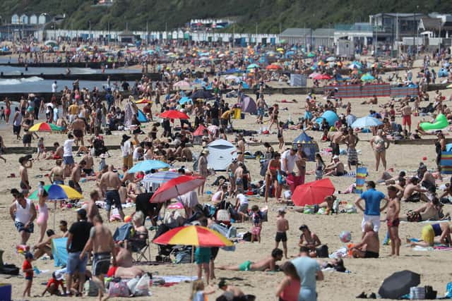 People enjoy the hot weather on Bournemouth beach in Dorset - Andrew Matthews/PA Wire