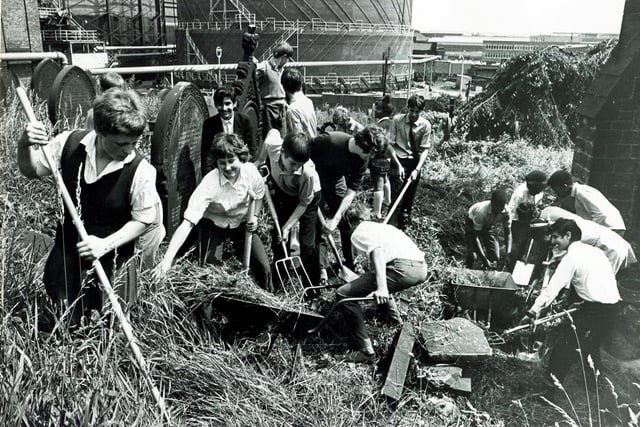 Pictured at work clearing up the graveyard at St Thomas' Church, Holywell Road, Brightside, Sheffield, as part of Springclean 69, are these 4th formers from Hinde House Comprehensive School, Sheffield, July 3, 1969
