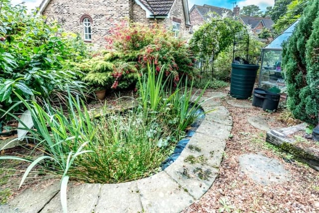 The home, set in a quiet cul-de-sac, has a landscaped garden
