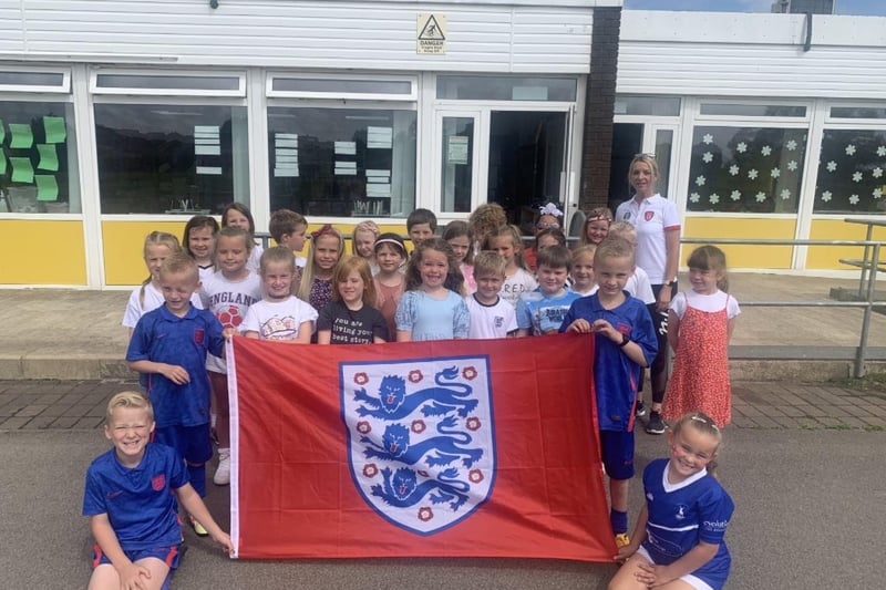 Throston Primary School pupils with their England flag.