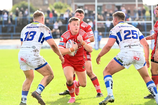 Dons' Jake Sweeting looks for a gap but Workington's defence were a tough nut to crack.