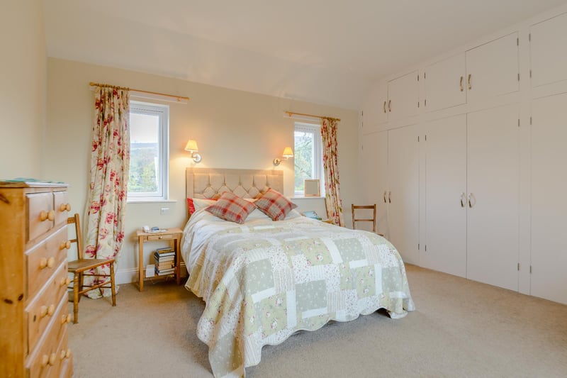 Situated on the first floor is the generous principal bedroom with its en suite bathroom and extensive fitted storage.