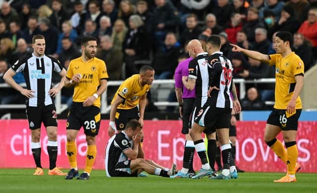 Ryan Fraser of Newcastle United reacts after picking up an injury against Wolverhampton Wanderers last month.