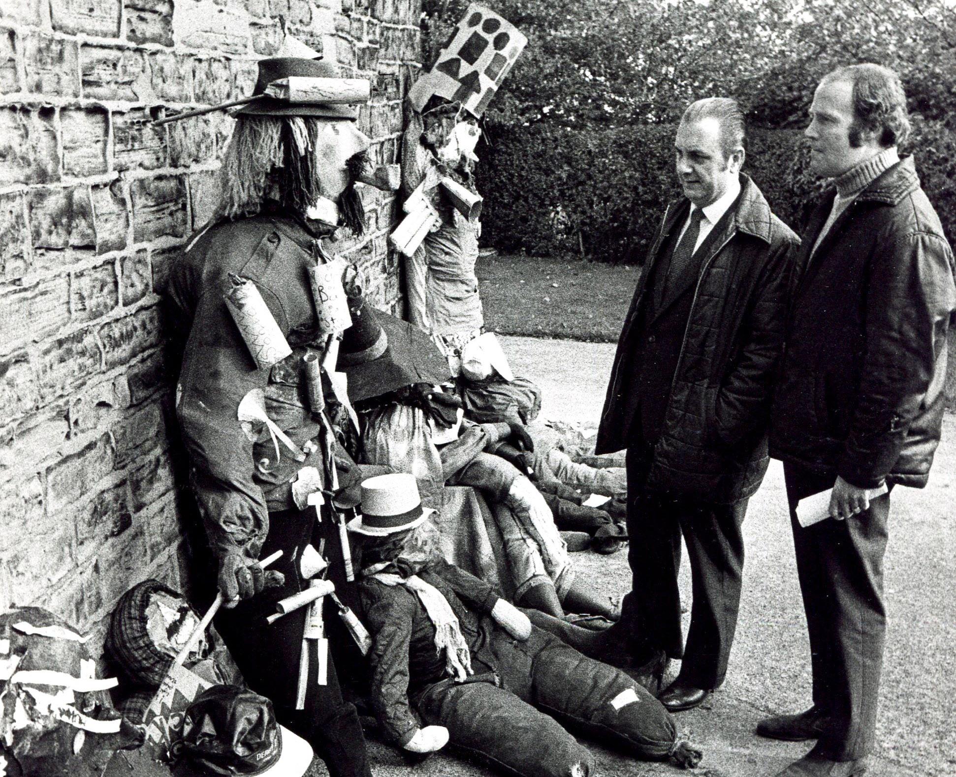 Ald Jock Sturrock, Chairman of the Sheffield Recreation Committee, and Mr Jim Bingley, Recreation Officer, judging the entries from local schools in the Guy Fawkes making competition at Concord Park, October 26, 1973