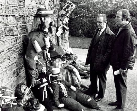 Ald Jock Sturrock, Chairman of the Sheffield Recreation Committee, and Mr Jim Bingley, Recreation Officer, judging the entries from local schools in the Guy Fawkes making competition at Concord Park, October 26, 1973
