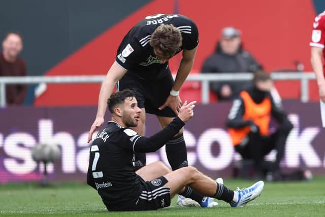 George Baldock of Sheffield United goes down following a heavy challenge at Bristol City: Darren Staples / Sportimage