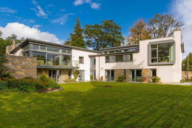 Substantial, modern property of architectural merit with fantastic light filled spaces and a beautiful garden. Offers over £2,000,000.