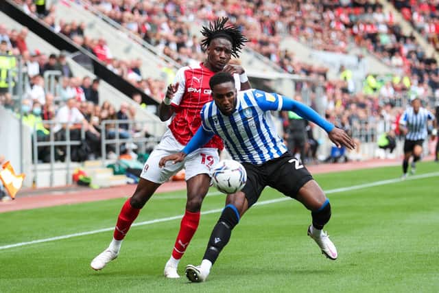 Rotherham United's Joshua Kayode (left) and Sheffield Wednesday's Chey Dunkley battle for the ball during the Sky Bet League One match at the AESSEAL New York Stadium, Rotherham. Picture date: Saturday August 21, 2021. PA Photo. See PA story SOCCER Rotherham. Photo credit should read: Isaac Parkin/PA Wire.