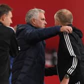 Jose Mourinho and Chris WIlder share an embrace after Sheffield United's win over Tottenham